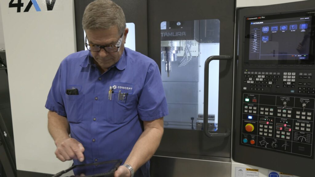 calibration tech working with a tablet at Concept. 