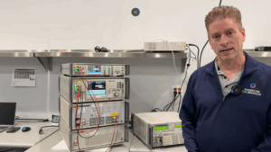 Technician performing electronic calibration using low uncertainty budget equipment.